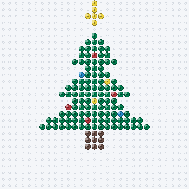 A tiered green Christmas tree fuse-bead pattern with a yellow star, red and blue ornaments and a brown trunk, on a pegboard grid.