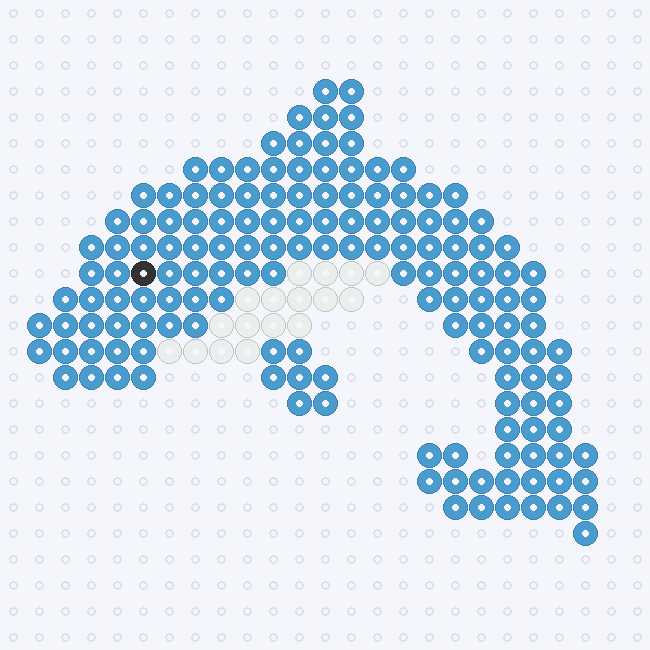 A Pastel Blue dolphin with a curved body, pointed fins, a White underside and a Black eye, on a pegboard grid.