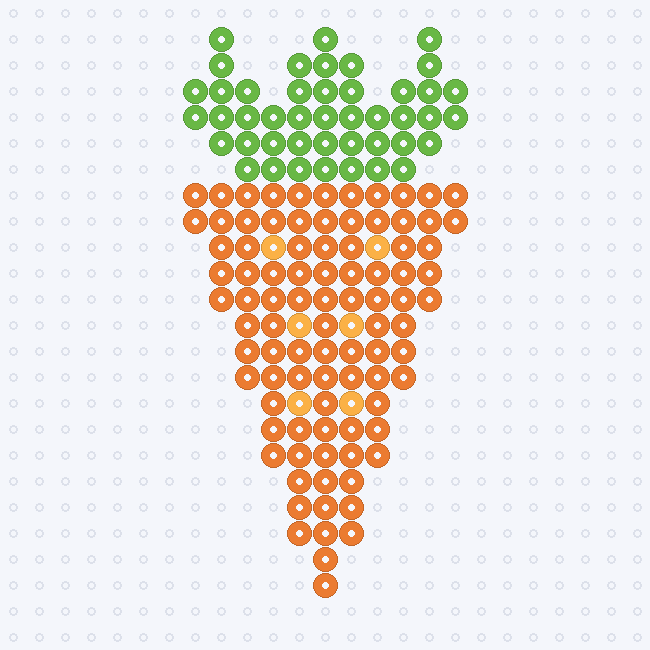 An orange carrot tapering to a point with lighter ridges and a spread of green leaves at the top, as a fuse-bead pattern on a pegboard grid.