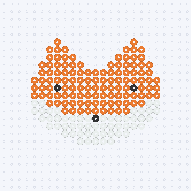 An orange fox face fuse-bead pattern with pointed ears, white cheeks and a black nose, on a pegboard grid.