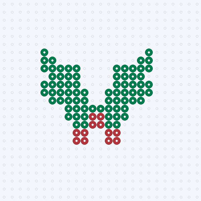 A dark green holly leaf fuse-bead pattern with pointed lobes and three red berries near the base, on a pegboard grid.
