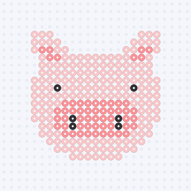 A Carnation Pink pig face with pointed ears, Blush inner ears and snout, and Black eyes and nostrils, on a pegboard grid.