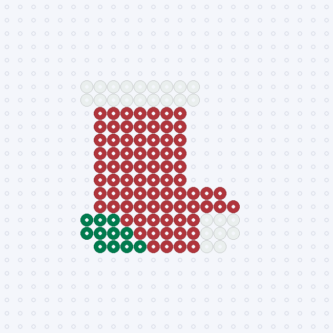 A red Christmas stocking fuse-bead pattern with a white cuff, green heel and white toe, on a pegboard grid.