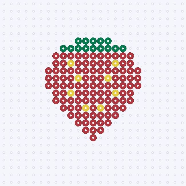 A red strawberry with a dark green leafy crown and paired yellow seeds, tapering to a bottom point on a pegboard grid.