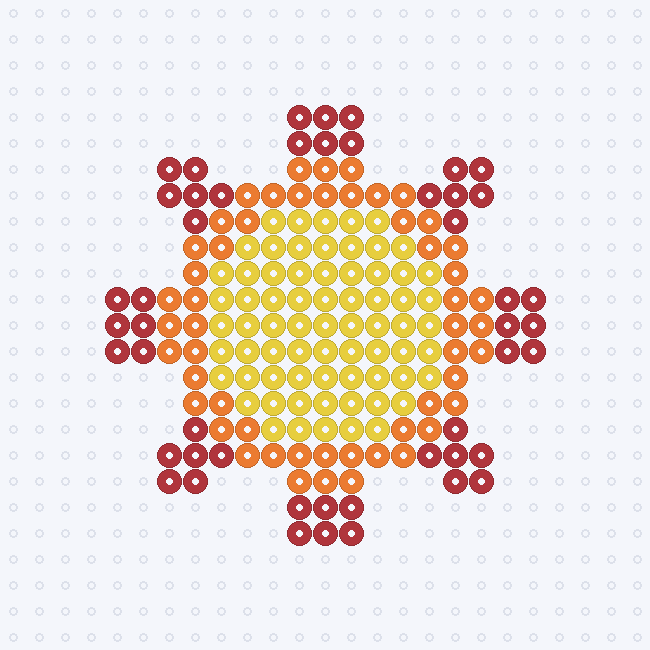 A round yellow sun with an orange rim and red rays, mirrored left to right on a pegboard grid.