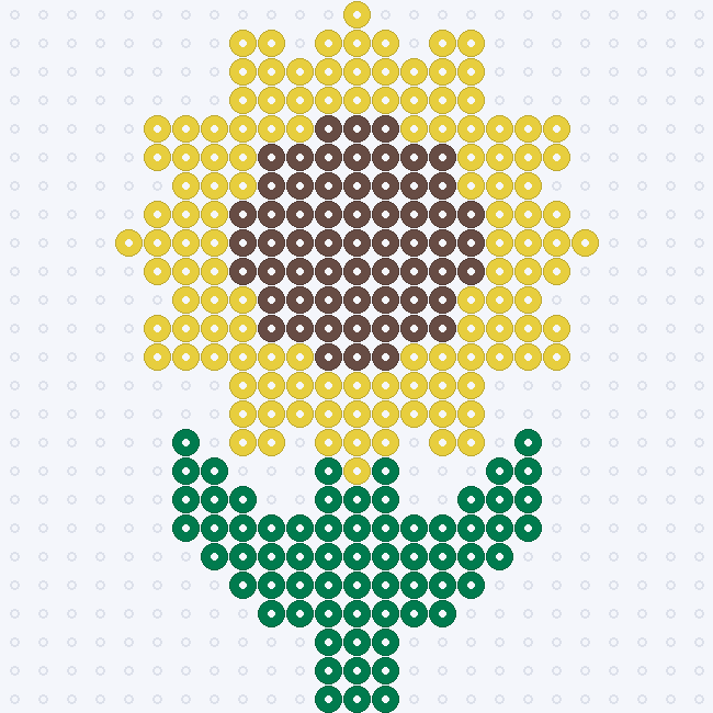 A sunflower with pointed yellow petals, a broad brown center and mirrored dark green leaves on a pegboard grid.