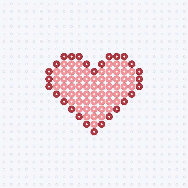 A heart with a red outline and a light pink fill as a fuse-bead pattern on a pegboard grid.